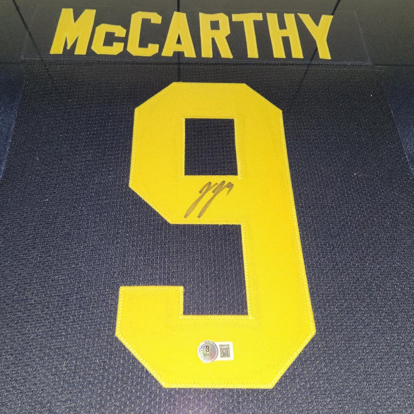 JJ McCarthy Autographed Michigan Wolverines (Blue #9) Deluxe Framed Jersey - Beckett