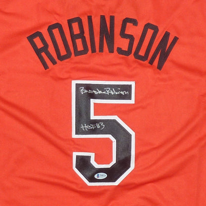 Brooks Robinson Autographed Baltimore Orioles (Orange #5) Jersey with "HOF 83" - Beckett