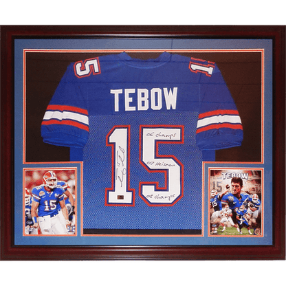 Tim Tebow Autographed Florida Gators (Blue #15) Deluxe Framed Jersey w/ "06 Champs", "07 Heisman", "08 Champs" - Tebow Holo