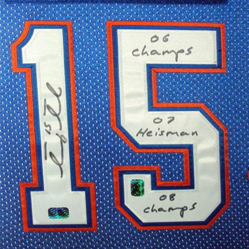 Tim Tebow Autographed Florida Gators (Blue #15) Deluxe Framed Jersey w/ "06 Champs" , "07 Heisman" , "08 Champs" - Tebow Holo