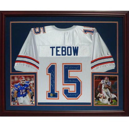 Tim Tebow Autographed Florida Gators (White #15) Deluxe Framed Jersey w/ "06 Champs" , "07 Heisman" , "08 Champs" - Tebow Holo